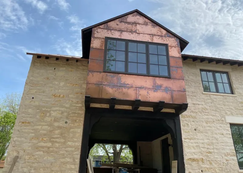 Copper metal panel facade on a stone building for Metal Roof Coating in Oroville