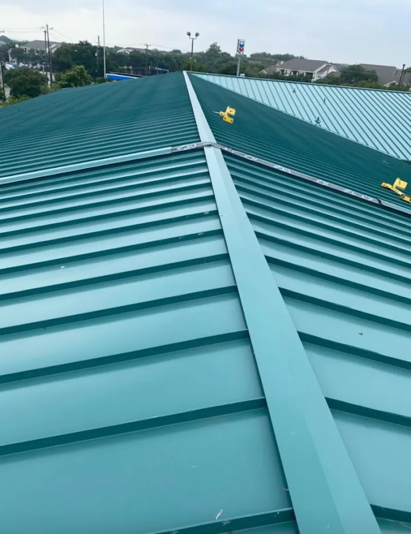 Green commercial metal roof ridge and valley for Metal Roof Repair in Oroville