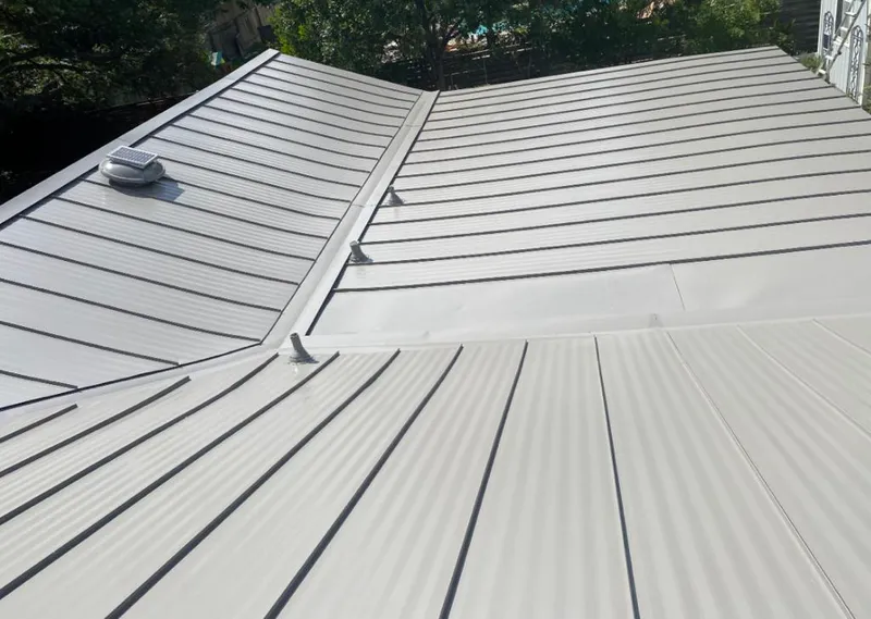 Solar attic fan installed on a metal roof for Roof Ventilation in Oroville